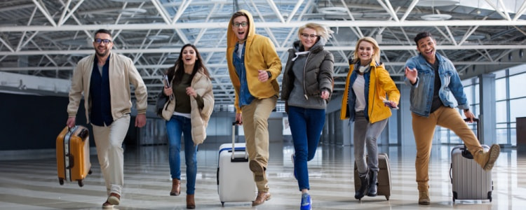 Happy Seattle tourists moving through the airport